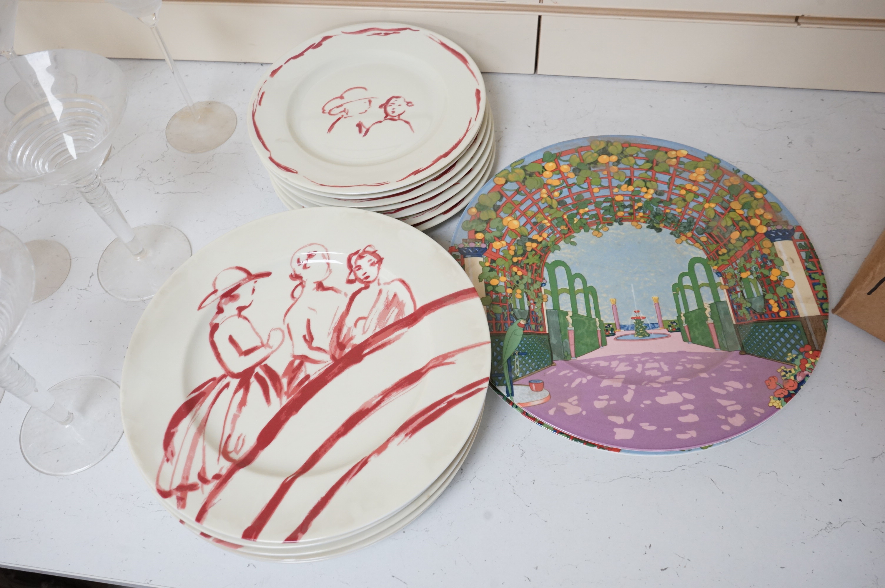 A Pierre Frey ‘Gonesse’ Limoges part dinner service, two Villeroy and Boch ‘Jardins Francais’ dinner plates, with a collection of Riedel wine glasses and mixed Salviati champagne glasses. Villeroy and Boch plates 30.5cm